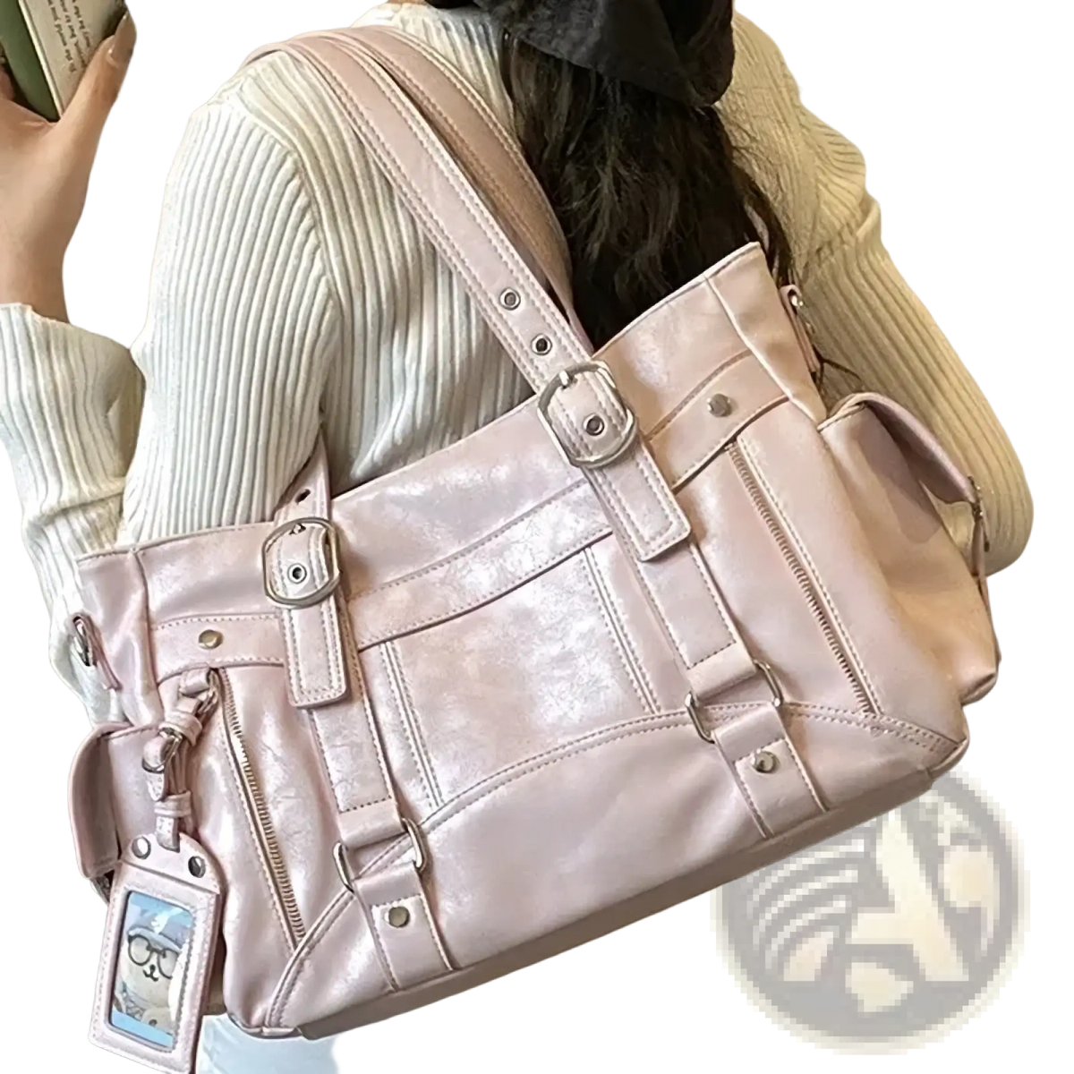 A blush pink glossy faux leather crossbody bag with large capacity silver hardware and multiple straps for commuting