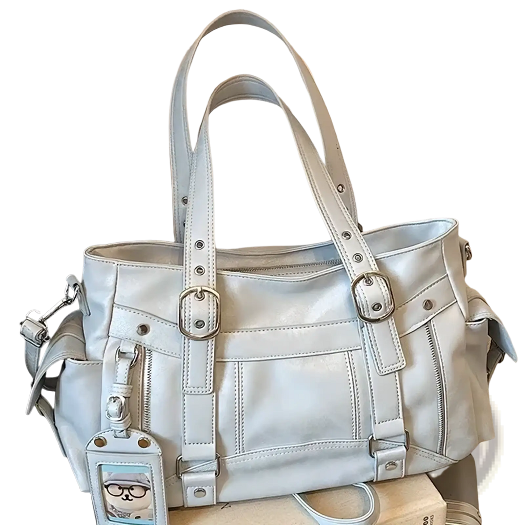 Light gray leather crossbody bag with large capacity silver hardware and cartoon cat charm for commuting use