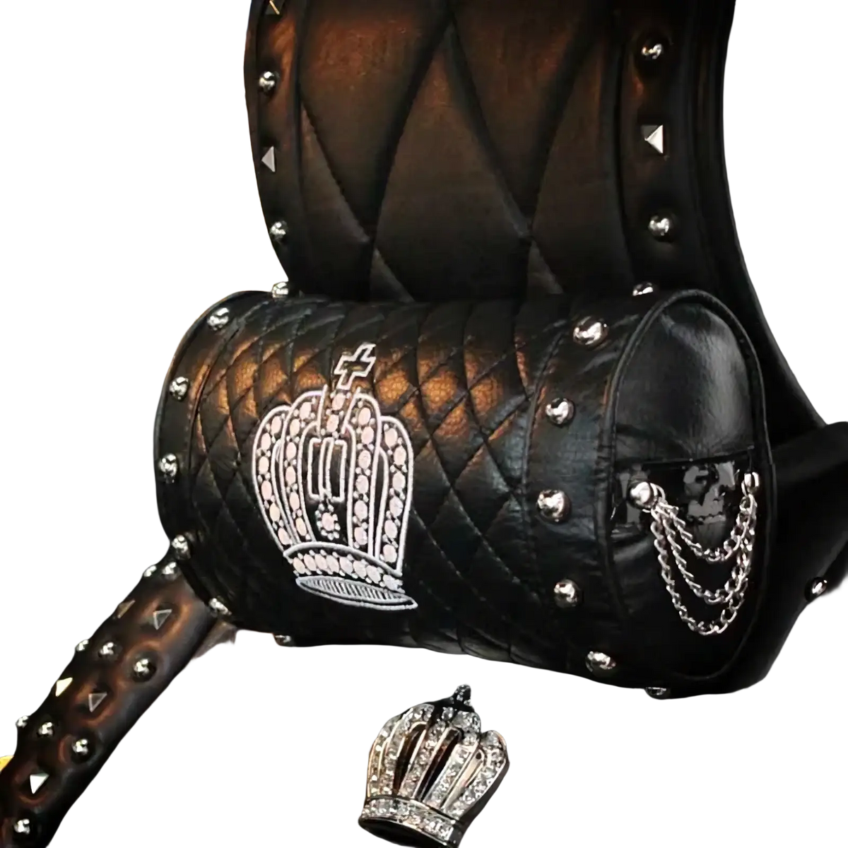Black quilted leather car headrest pillow with white embroidered crown, silver studs, and dangling chain detail from crown leather set