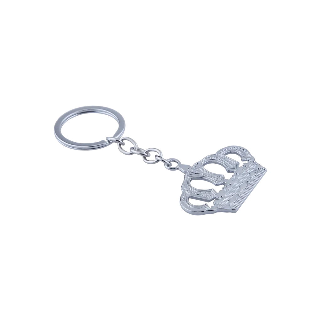 Silver-toned metal keychain featuring an intricately detailed crown charm with embossed patterns and polished finish