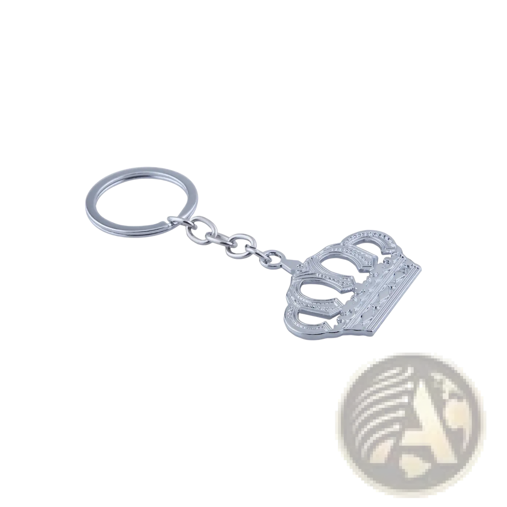 Silver-toned metal keychain featuring an intricately detailed crown charm with embossed patterns and polished finish
