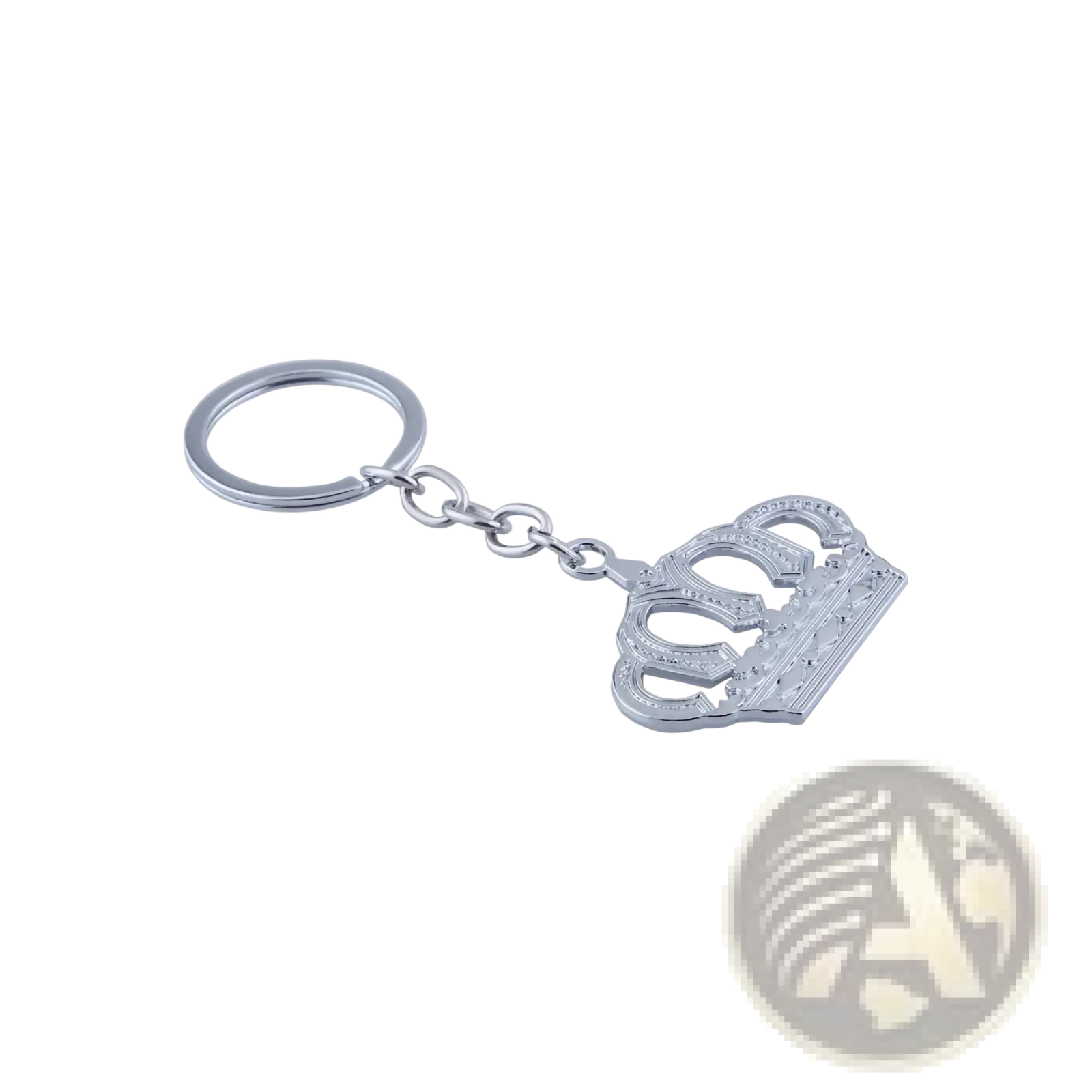 Silver-toned metal keychain featuring an intricately detailed crown charm with embossed patterns and polished finish