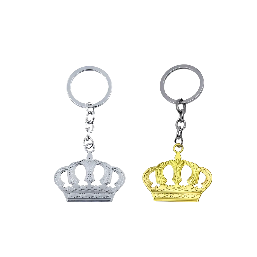 Two metallic crown metal keychains in silver and gold with ornate design and circular ring attachments