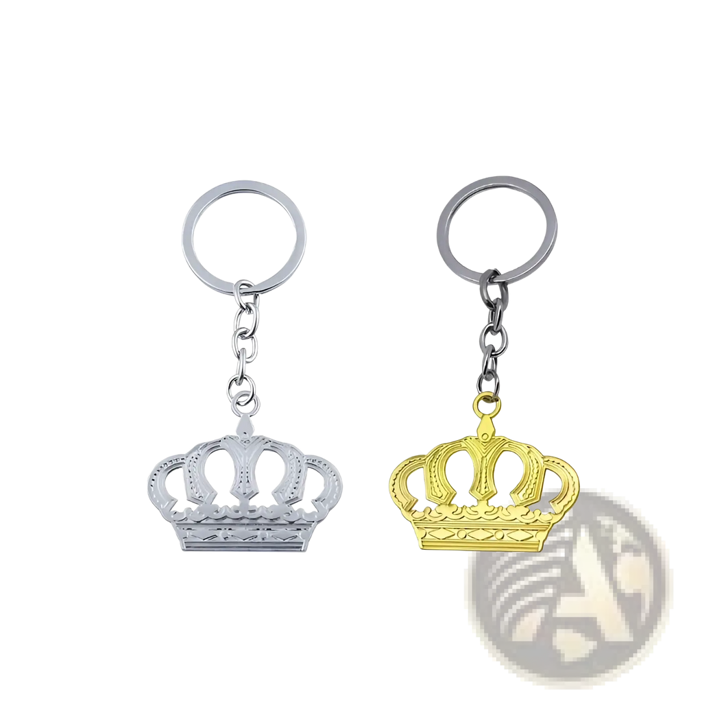 Two metallic crown metal keychains in silver and gold with ornate design and circular ring attachments