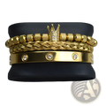 Gold-toned crown adorned beaded bracelet set with diamond accents and braided bands in a luxurious design