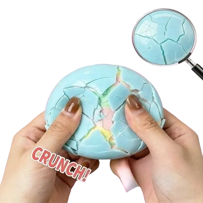 A light blue cracked plastic crunchy stress ball sensory fidget toy with a glossy finish and colorful interior visible