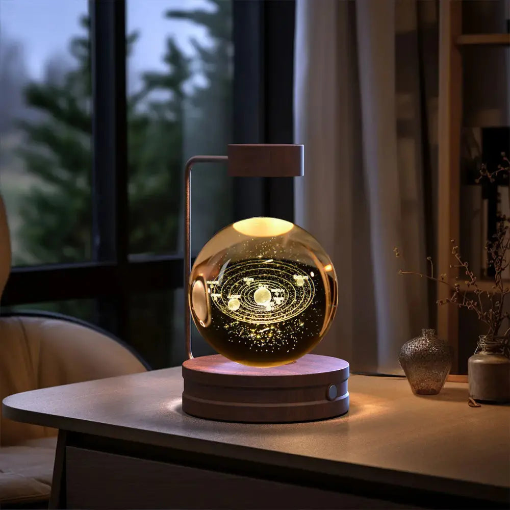 3d crystal ball dinosaur night light with golden spherical led light, illuminated planetary orbits, and metallic stand