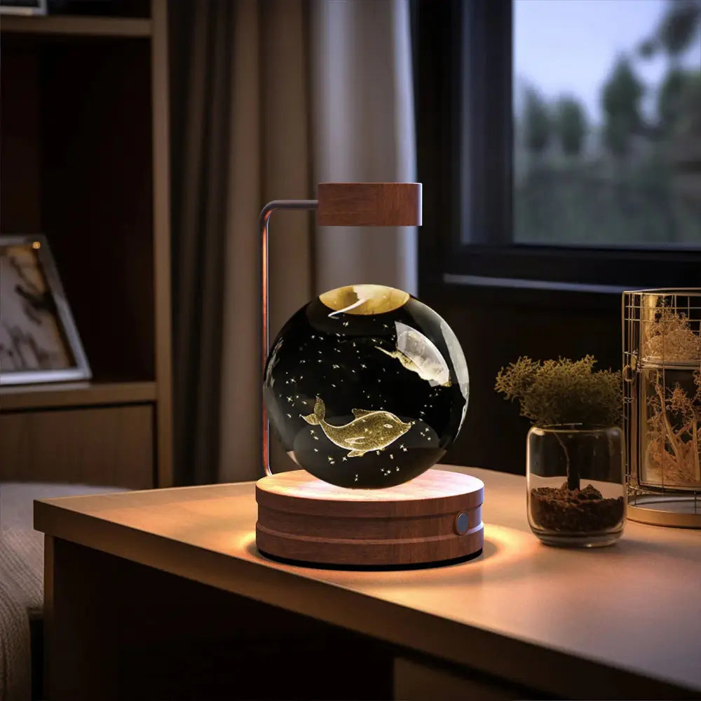Black spherical 3d crystal ball dinosaur night light usb lamp with gold whale and moon design on wooden base