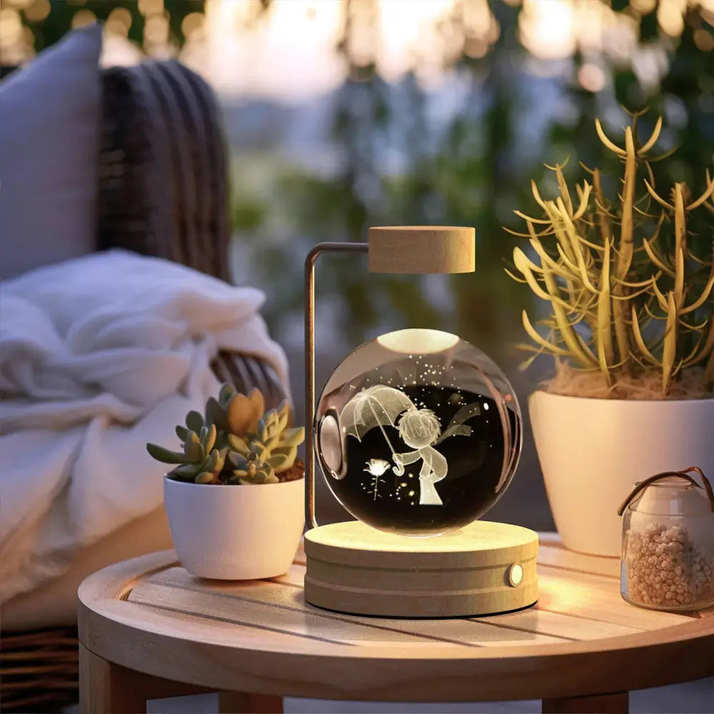 A glowing spherical led nightlight with a child holding umbrella illuminated on a 3d crystal ball dinosaur lamp