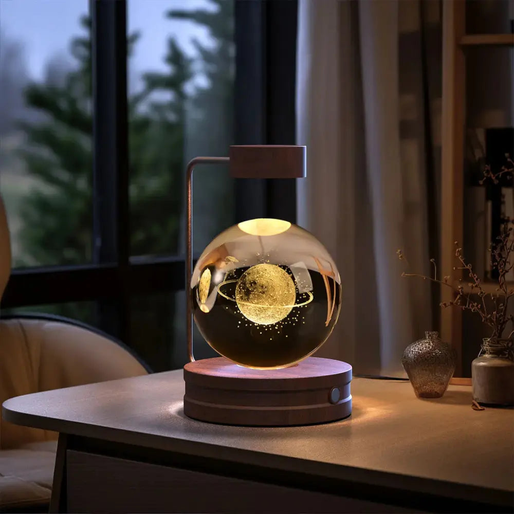 A sleek 3d crystal ball dinosaur night light usb bedside lamp with a floating glass globe and warm led illumination