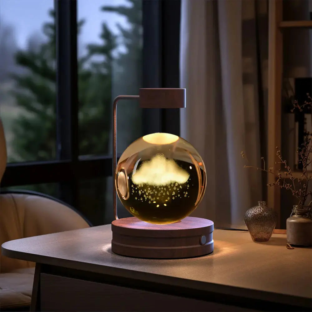 3d crystal ball dinosaur night light with floating golden glass globe illuminated by cloud and star particles on wooden base