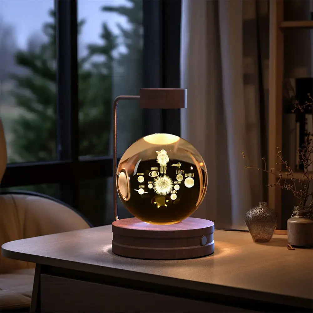 A sleek spherical 3d crystal ball dinosaur night light with transparent glass globe and illuminated astronaut design