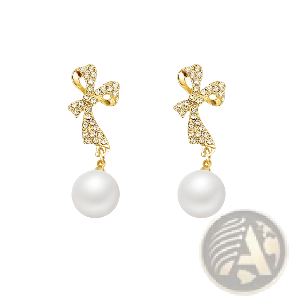Gold crystal bow earrings with sparkling crystals and white pearl dangles in elegant gold setting