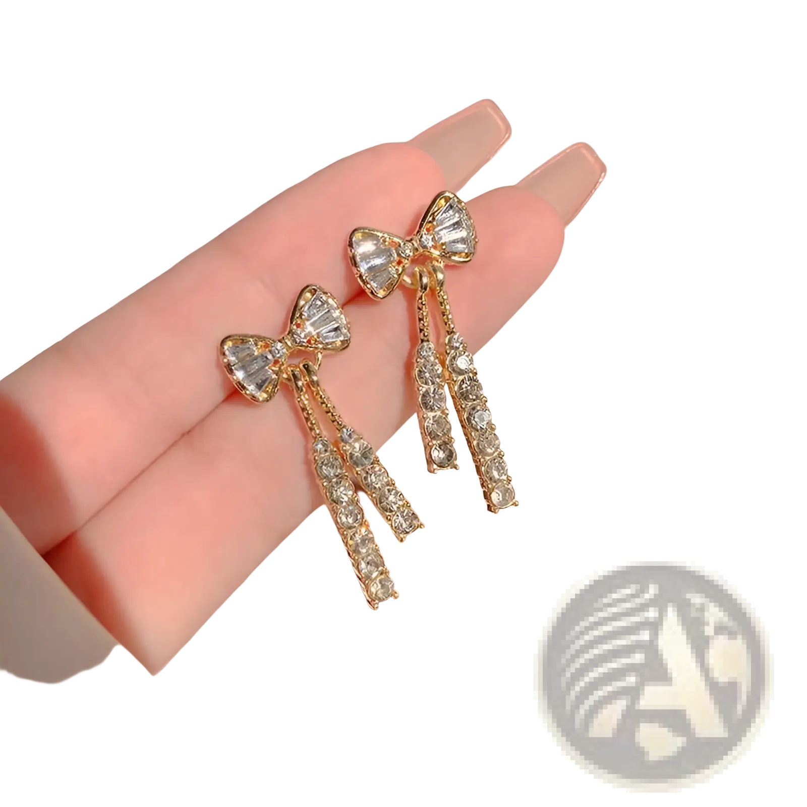 Gold-toned crystal bow and pearl dangle earrings with clear faceted crystals and dangling crystal strands