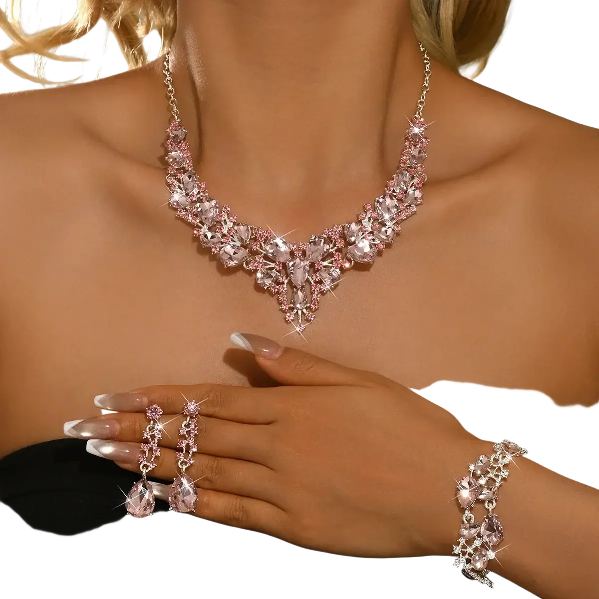 Crystal bridal jewelry set pink silver featuring a sparkling pink crystal necklace with v-shaped centerpiece and matching earrings and bracelet with silver-toned chains and settings