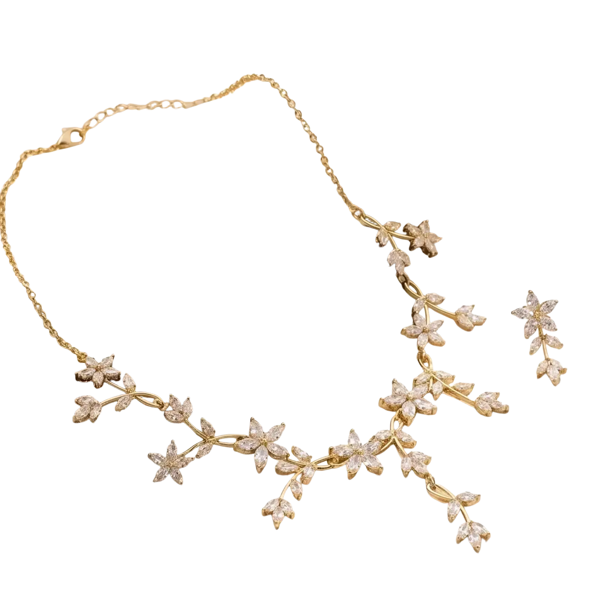 Crystal bridal necklace and earring set in gold tone with delicate floral and leaf motifs adorned with clear crystals