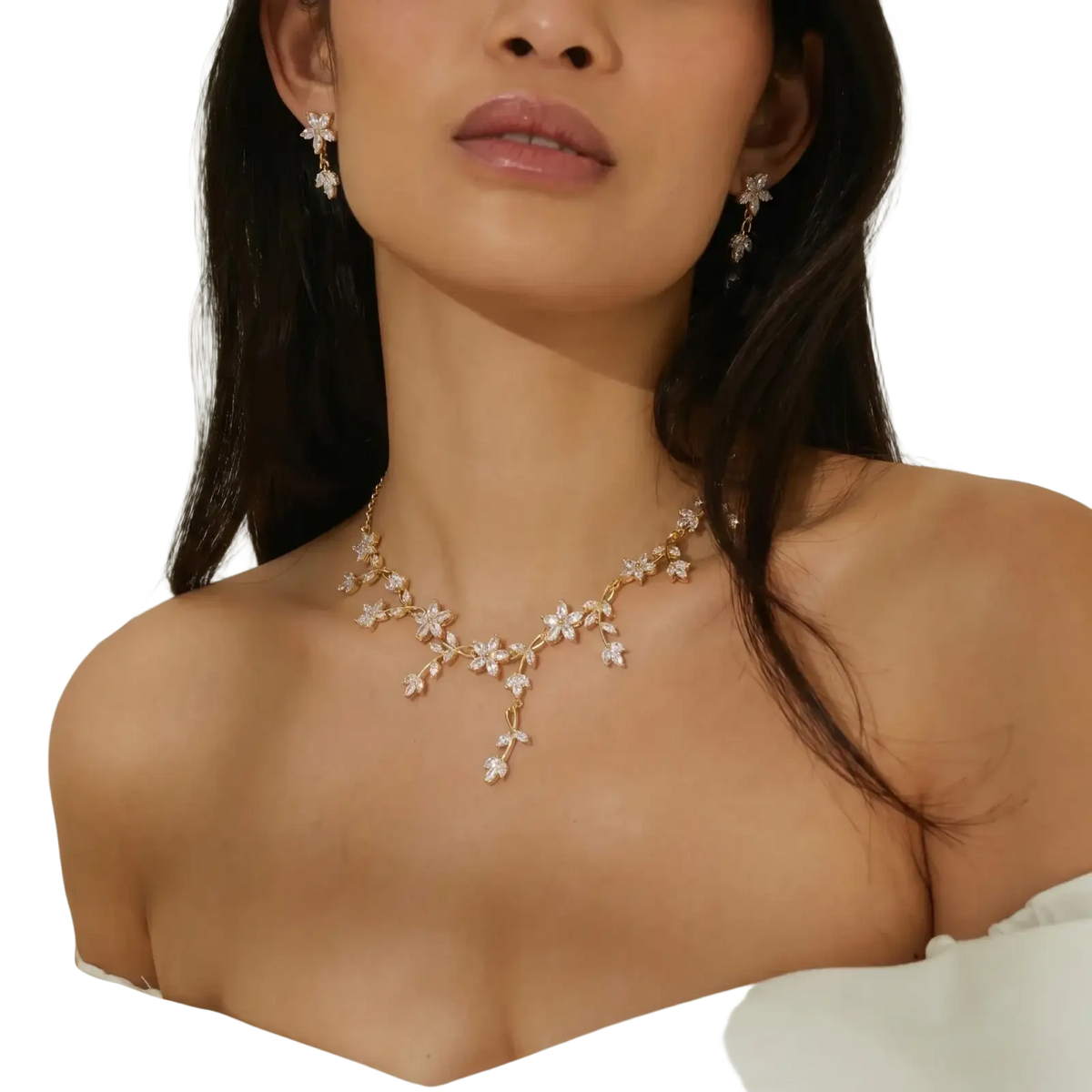 Gold-toned crystal bridal necklace featuring delicate floral designs with sparkling clear stones for weddings