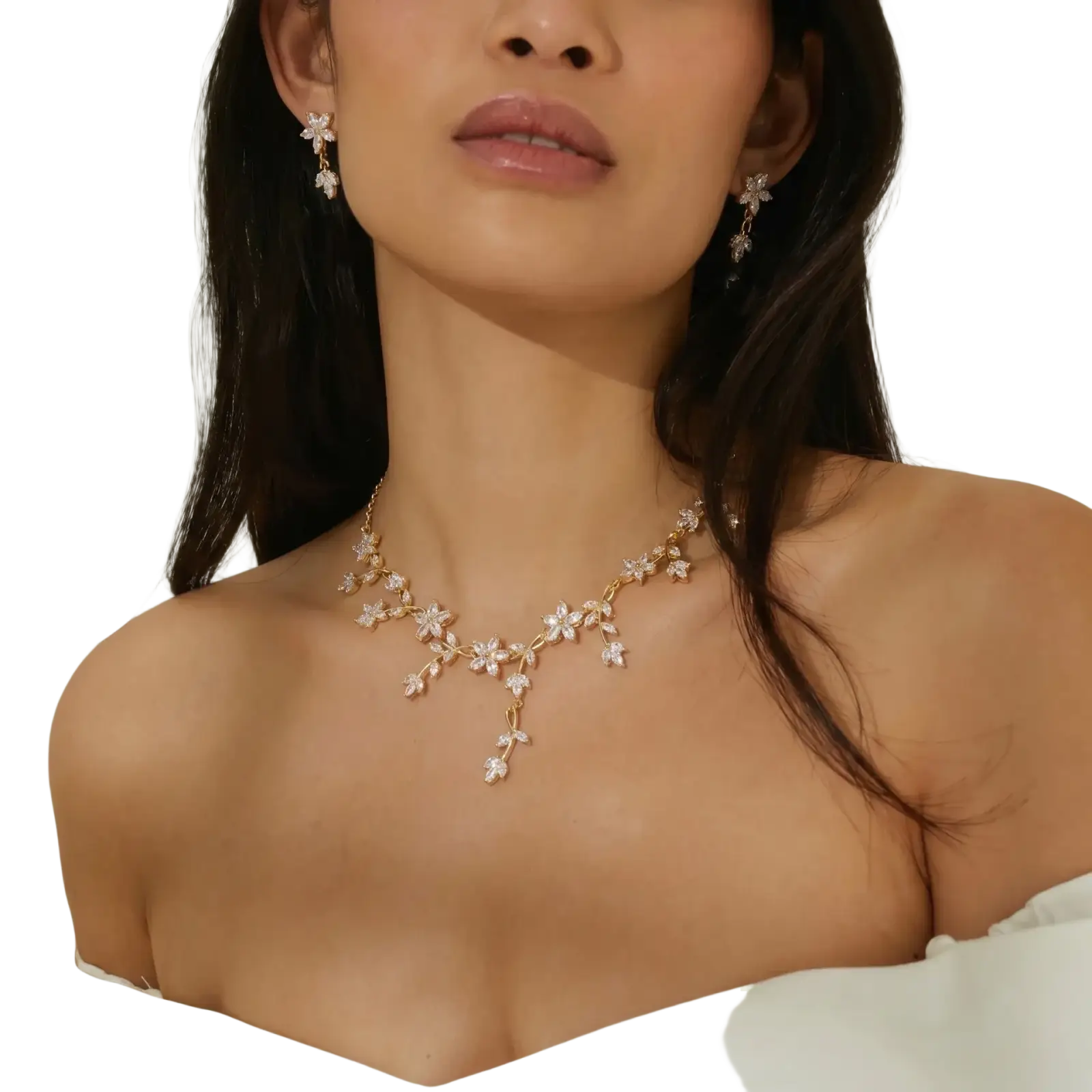 Gold-toned crystal bridal necklace featuring delicate floral designs with sparkling clear stones for weddings