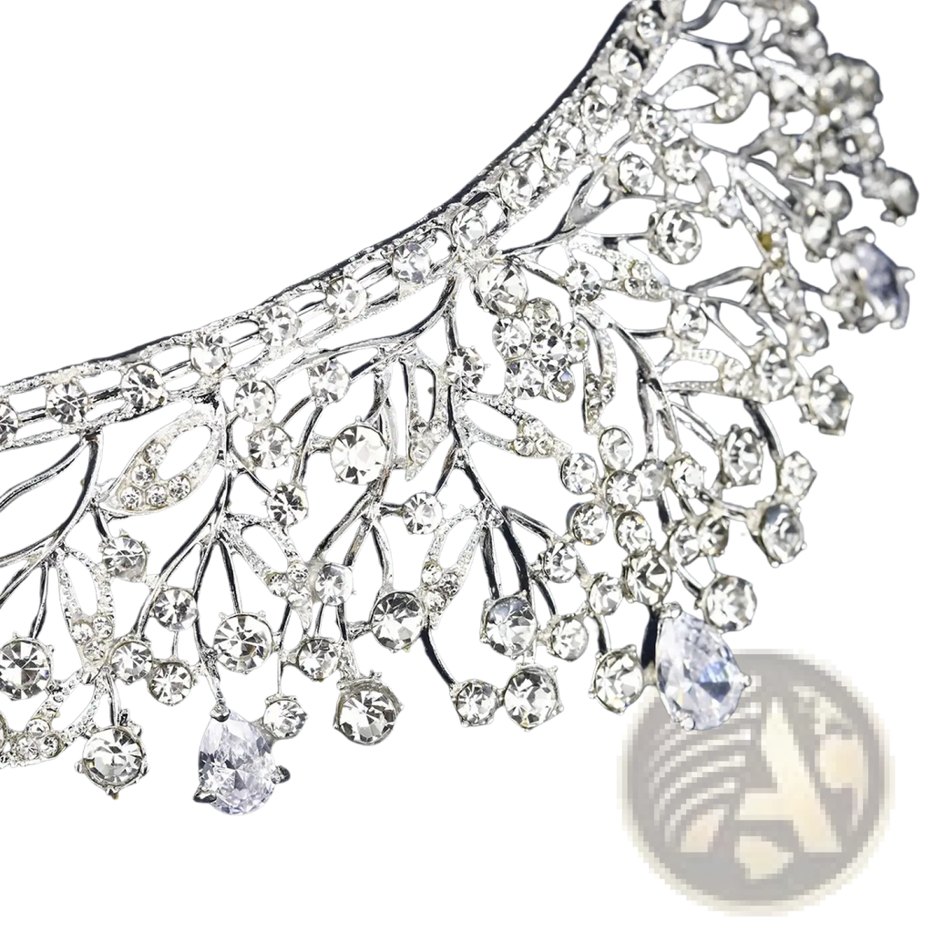 A sparkling silver crystal bridal tiara with intricate leaf and branch designs and cascading clear crystals