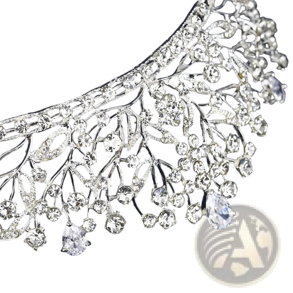 A sparkling silver crystal bridal tiara with intricate leaf and branch designs and cascading clear crystals