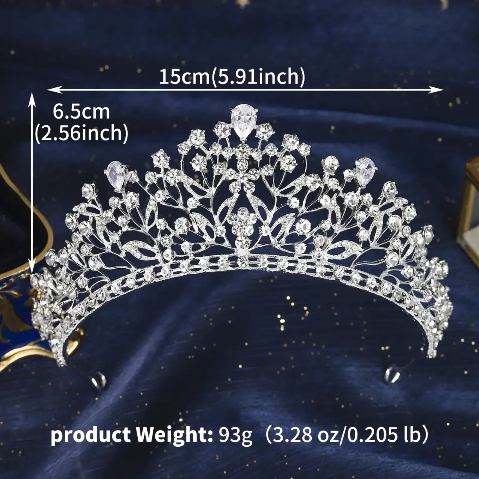 A crystal bridal tiara silver wedding crown with intricate floral designs and a central teardrop gemstone