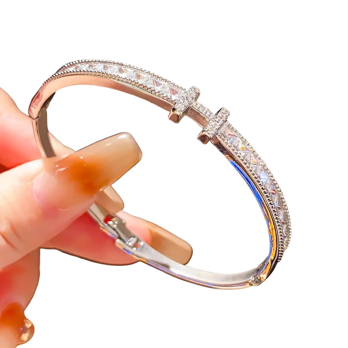 A sleek silver crystal cross cuff bracelet featuring princess cut crystals and two cross-shaped charms with clear stones