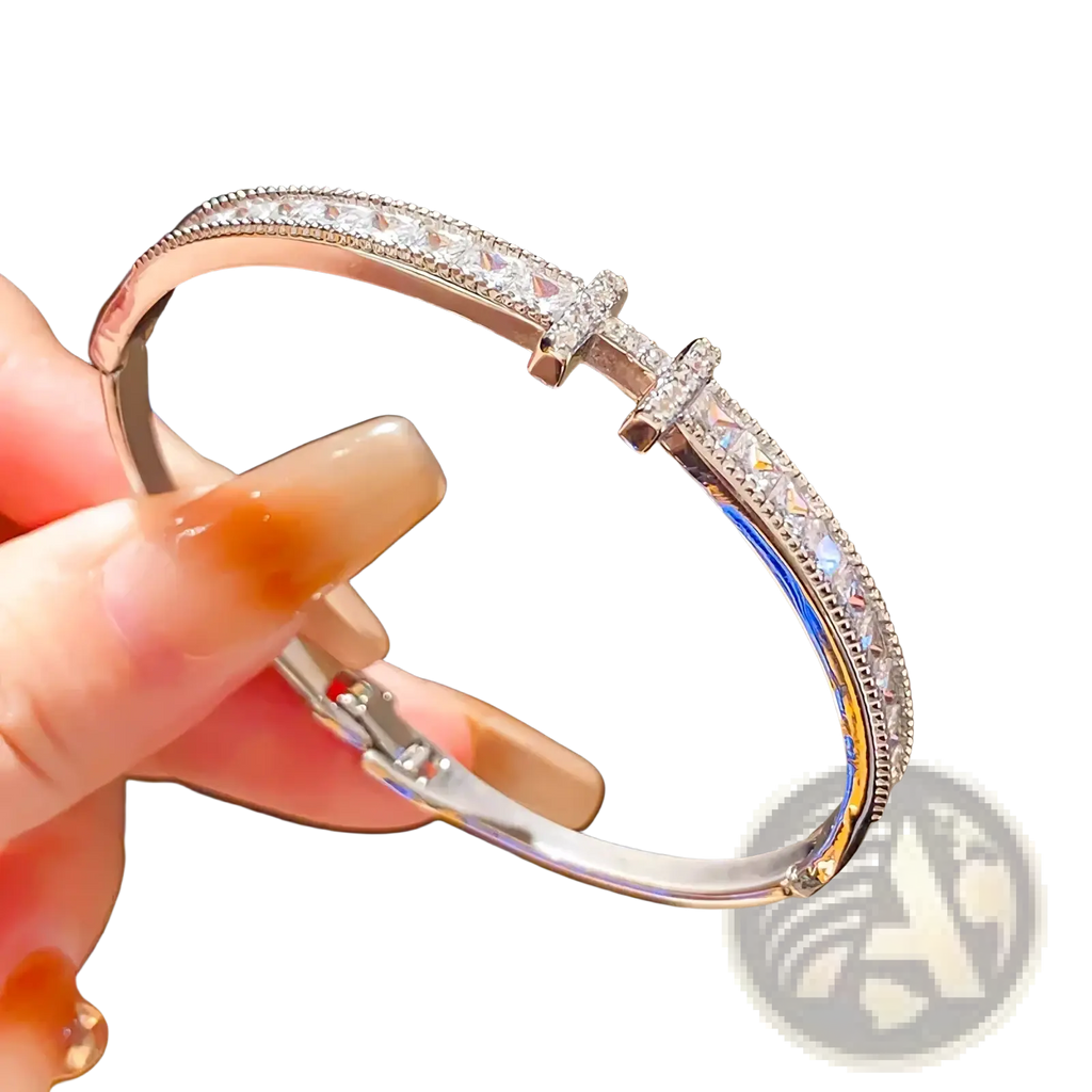 A sleek silver crystal cross cuff bracelet featuring princess cut crystals and two cross-shaped charms with clear stones