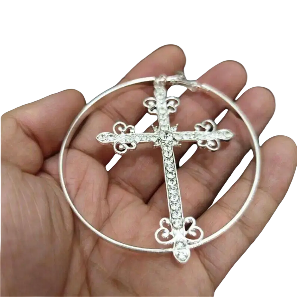 Silver crystal cross hoop earrings with intricate filigree design and clear rhinestones in punk jewelry style