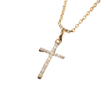 Gold cross pendant necklace featuring sparkling clear crystals on a delicate silver chain for elegant wear