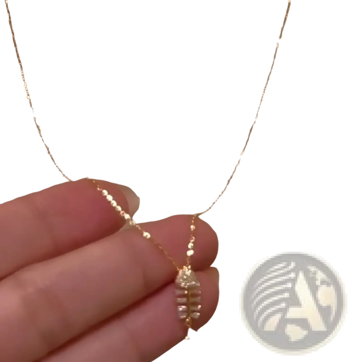 Crystal fishbone gold necklace pendant featuring a delicate gold chain with a leaf design and clear sparkling stones