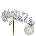 A sparkling silver crystal floral bridal tiara headband with intricate leaf and branch designs and clear stones
