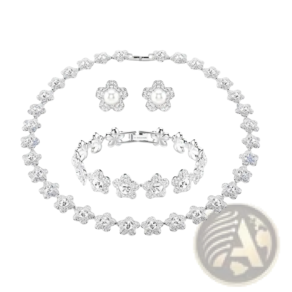 Silver crystal flower bridal jewelry set with intricate crystal-encrusted floral motifs and central pearl accents