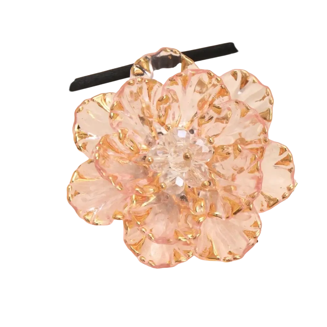Crystal flower brooch fashion accessory featuring delicate pink and gold faceted crystal petals with a clear gem center