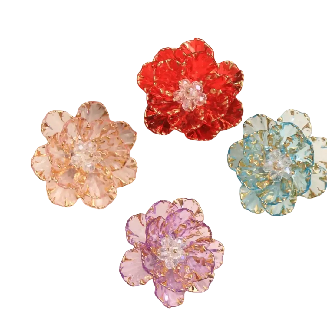 Crystal flower brooch fashion accessory with vibrant red pink blue and purple crystal petals and gold trim