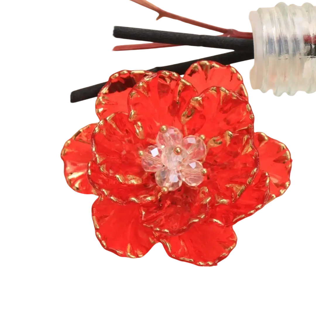 Crystal flower brooch featuring vibrant red glass petals with gold trim and a clear crystal center fashion accessory
