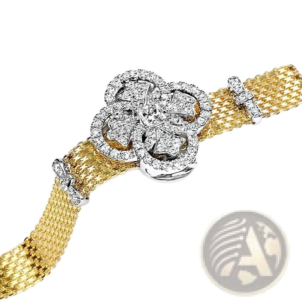 A gold mesh cuff bracelet with a crystal-adorned four-petal flower clasp and silver-toned metal accents