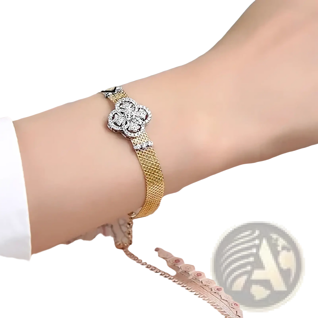 Crystal flower gold mesh cuff bracelet featuring a sparkling four petal flower clasp with clear crystals