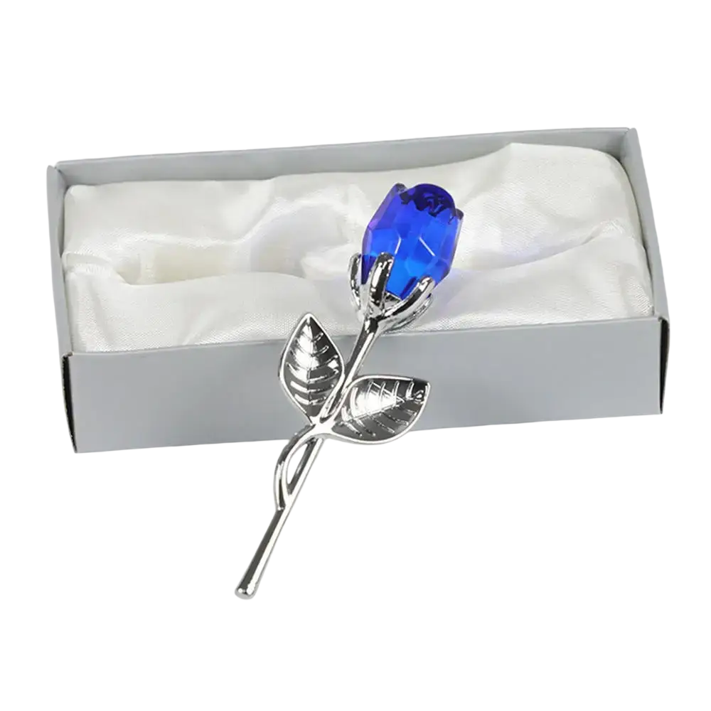 A sparkling blue crystal rose with silver metal stem and leaves in a gift box for valentine’s day