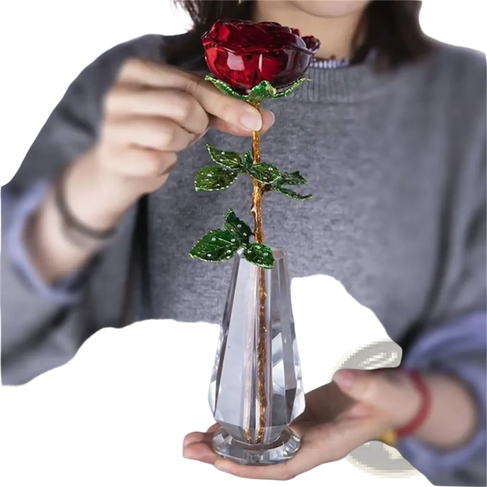 A crystal glass rose gift for Valentine’s Day with a sparkling red crystal flower green beaded leaves and a gold stem in a clear vase