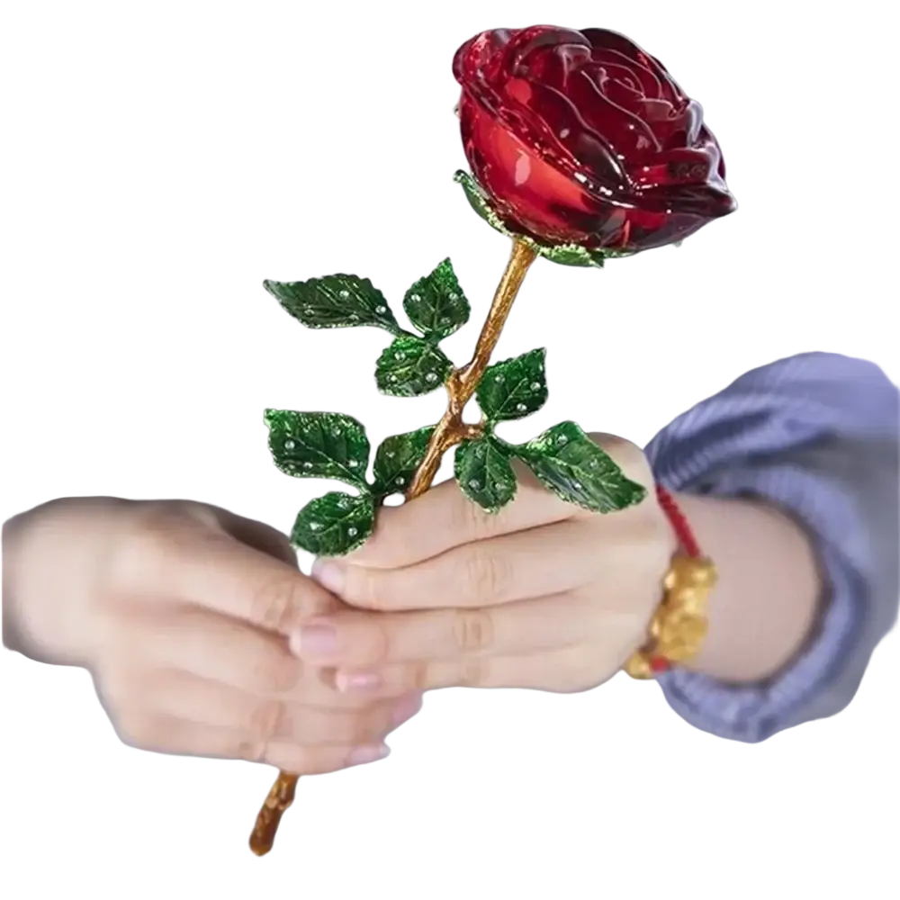 A translucent red crystal glass rose with a gold-toned stem and sparkling green leaves for Valentine’s Day gift