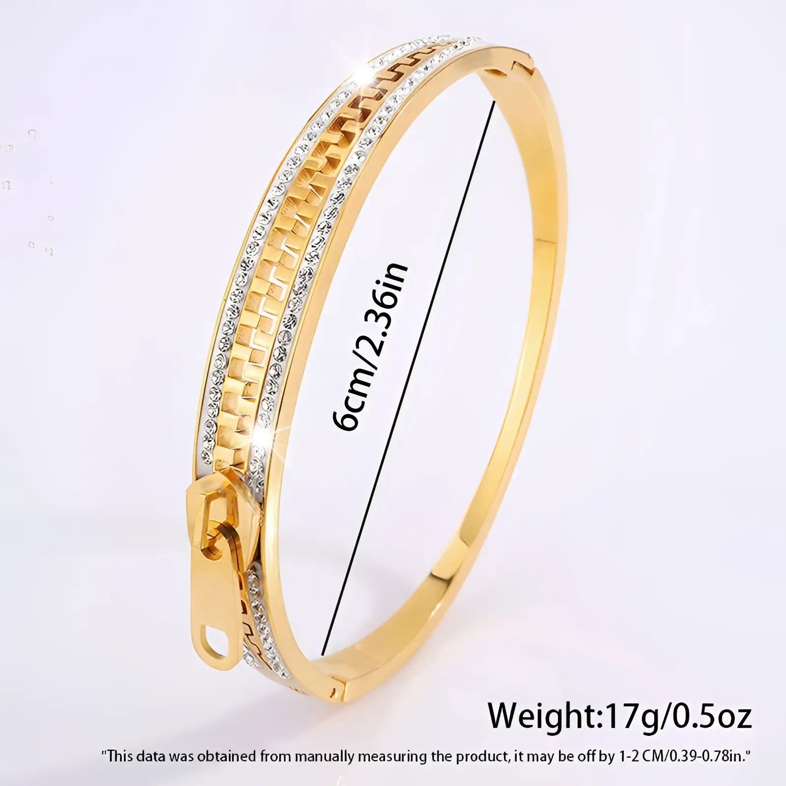 Gold-toned crystal interlocking titanium steel zipper bangle bracelet with textured chain and clear crystal accents