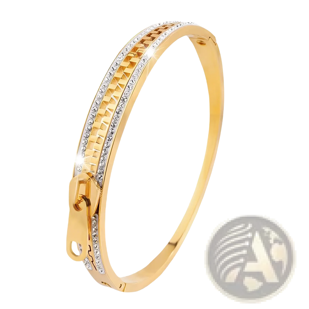 Gold-toned crystal interlocking titanium steel zipper bangle bracelet with textured pattern and clear crystals along inner edge