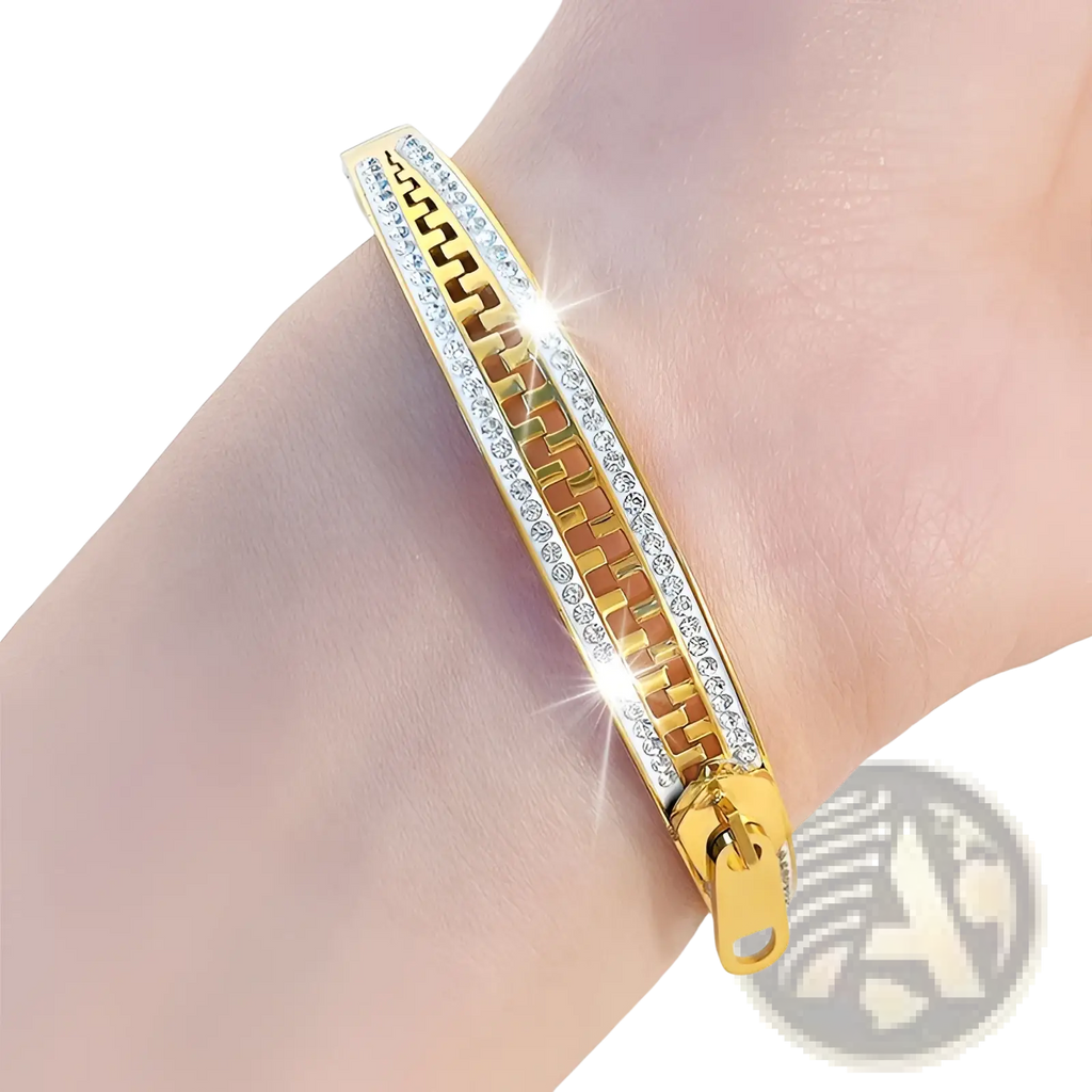 Gold-toned crystal interlocking titanium steel zipper bangle bracelet with geometric pattern and clear crystals on edges