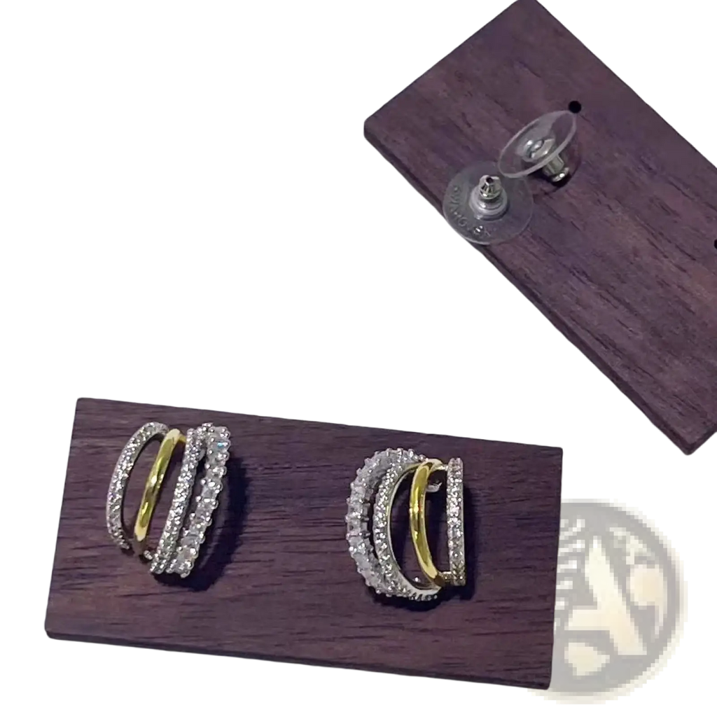 A pair of elegant multi-layered silver and gold hoop earrings with clear crystals from crystal jewelry set