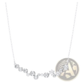 Delicate silver necklace from crystal jewelry set featuring curved row of round and snowflake-shaped diamonds on fine chain