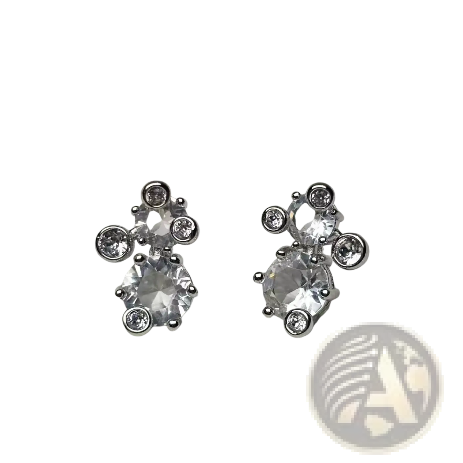 Silver stud earrings featuring an asymmetrical cluster of clear faceted crystals in crystal jewelry set