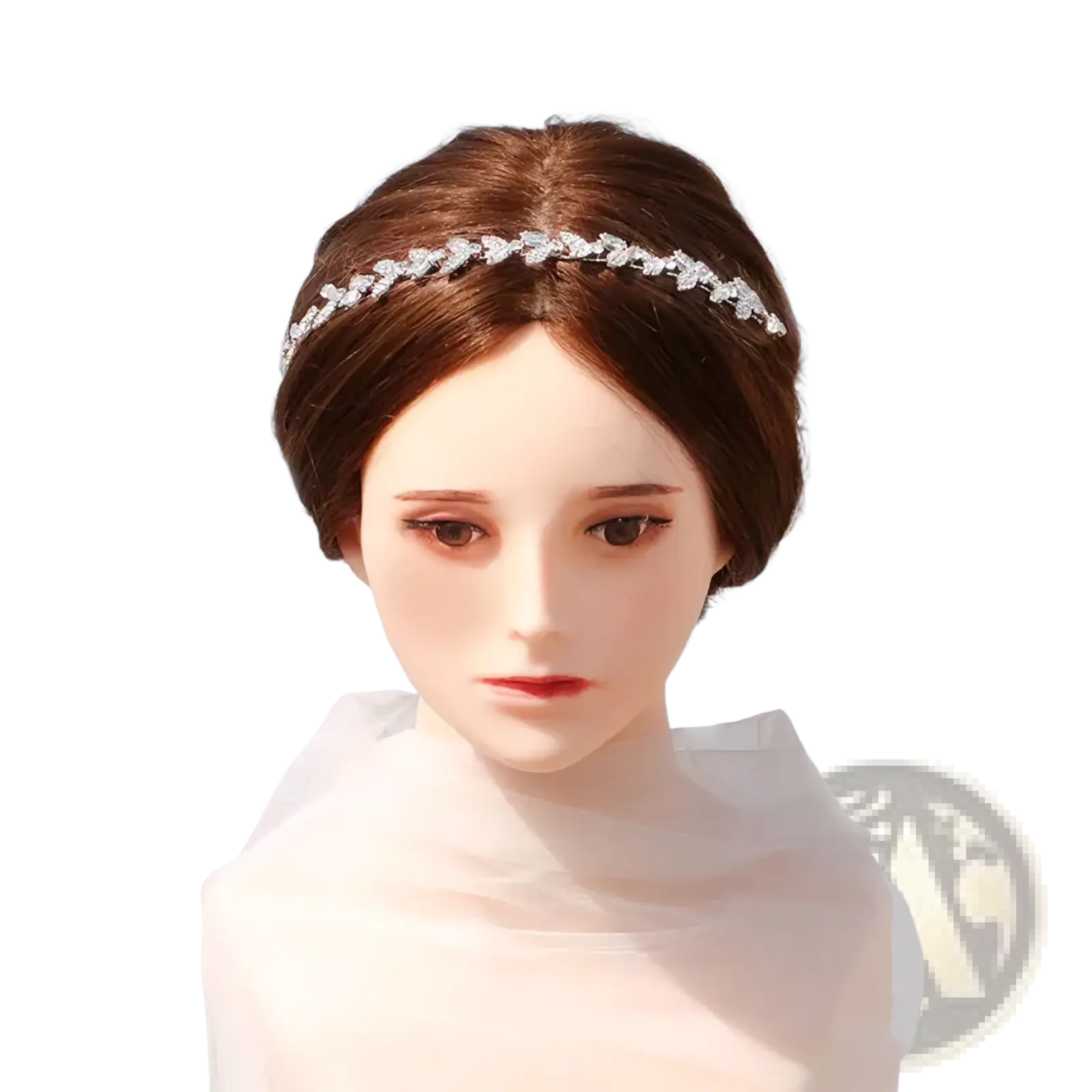 A delicate silver crystal leaf bridal headband adorned with sparkling rhinestones as a wedding hair accessory