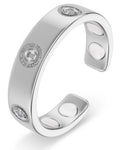Silver magnetic crystal therapy ring in stainless steel with three round-cut clear stones and accent diamonds in bezel setting