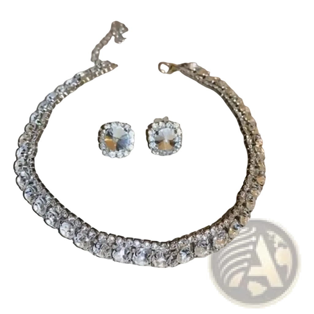 A sparkling silver-toned crystal necklace and earring set with clear faceted stones for pink ab wedding jewelry