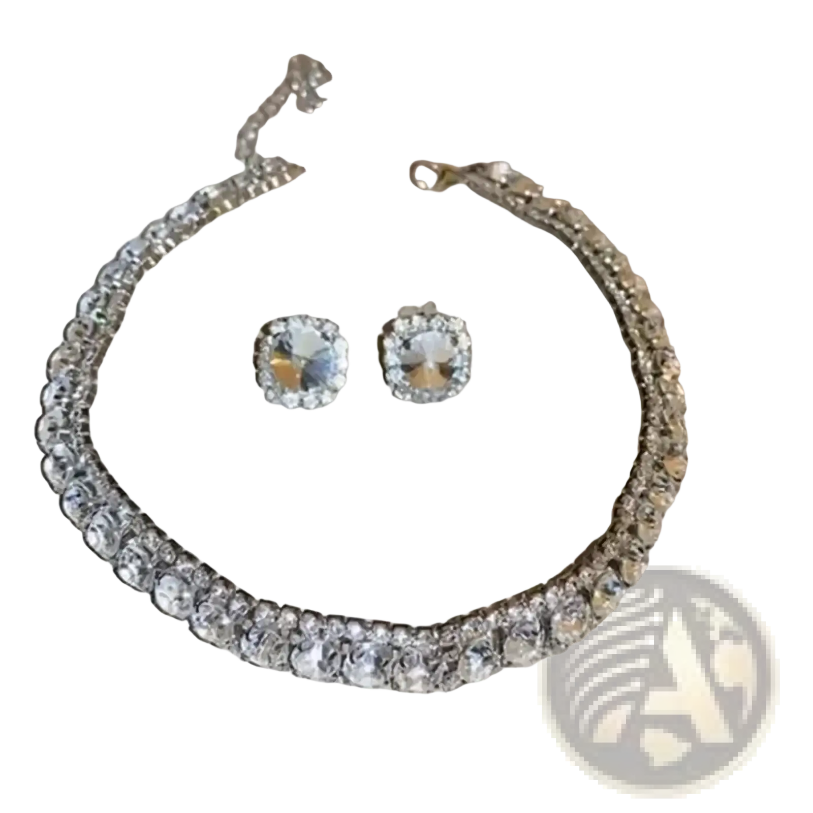 A sparkling silver-toned crystal necklace and earring set with clear faceted stones for pink ab wedding jewelry